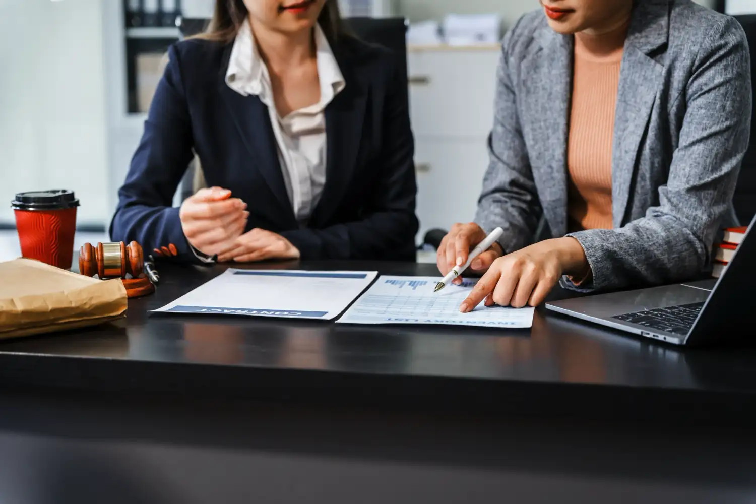 Two women looking over a legal case together