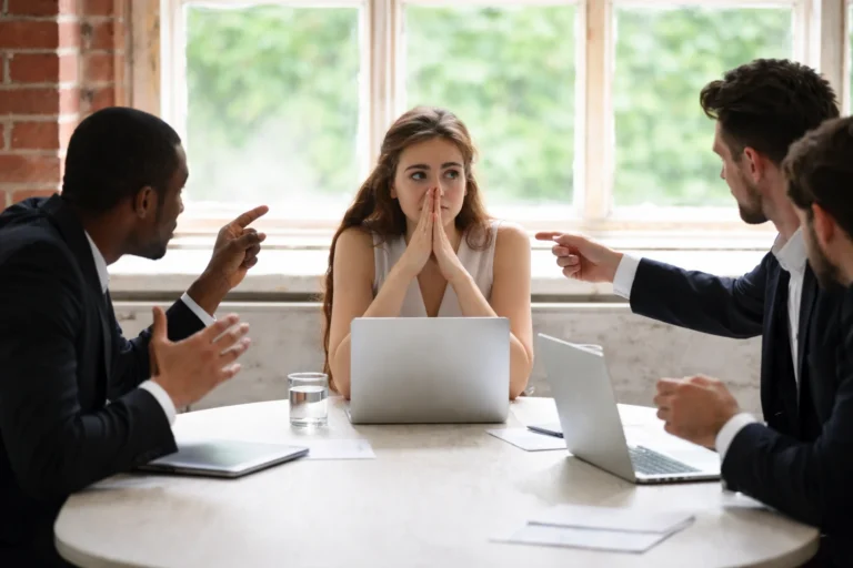 Young female being discriminated against by her male coworkers